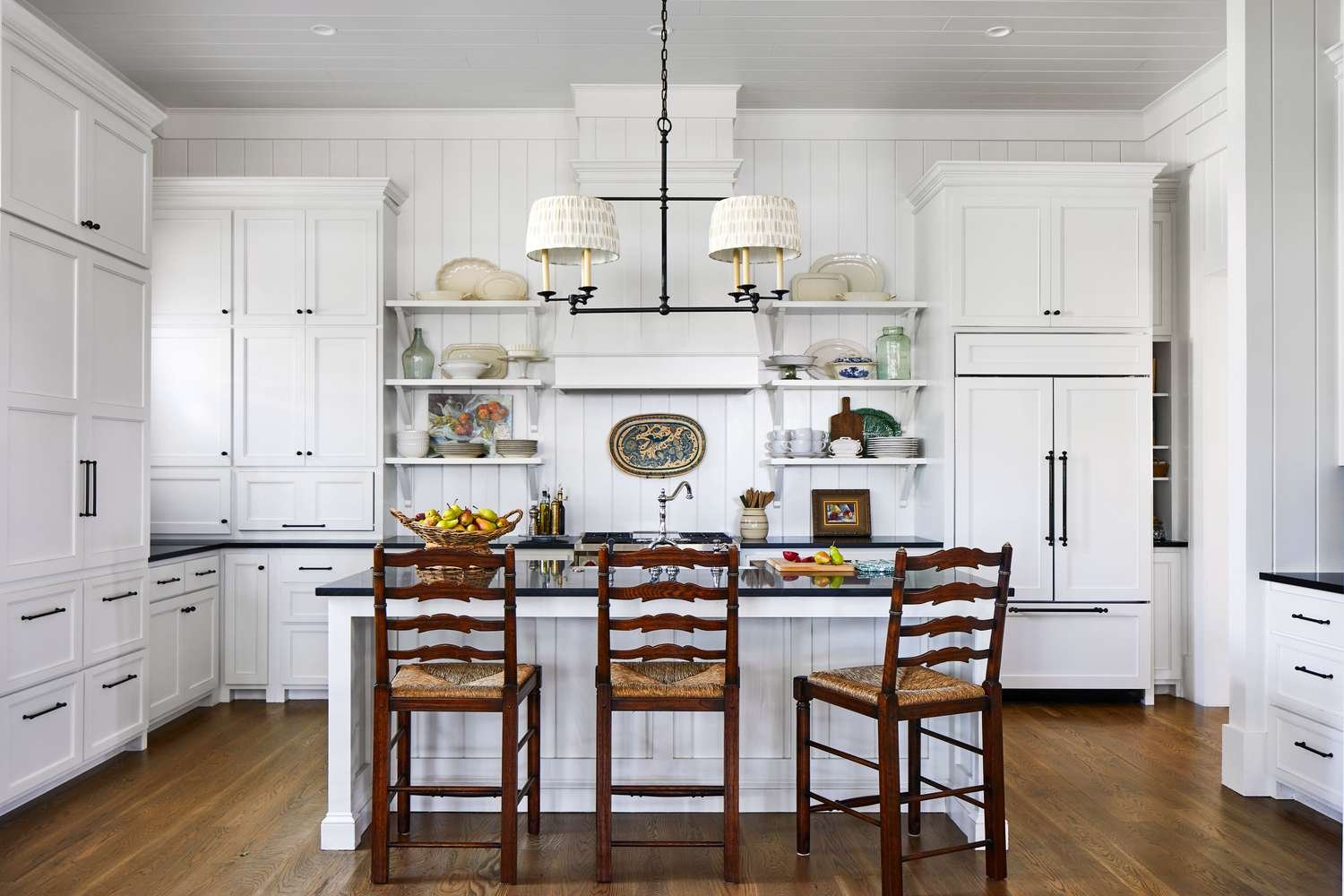 Rustic Charm Meets Function: 10 Kitchen Islands Next to Stone Fireplaces and Living Area Hearths